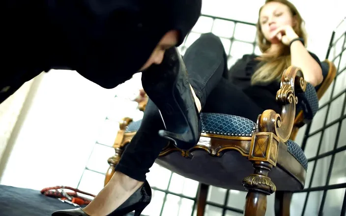 Czech Soles - foot fetish content: Foot slave under his mistress's feet and heels