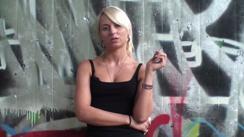 Femdom Austria: Lovely blonde teen smoking a cigarette outdoors