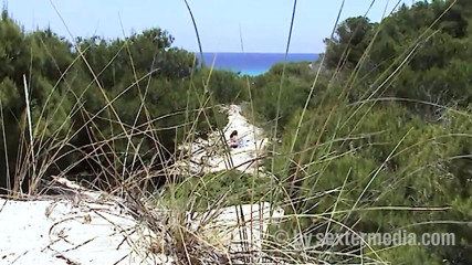 Sextermedia by Pete: Redhead beauty dildoing pussy on the sandy beach