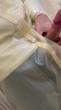Putting a Condom on in Transparent Latex Raincoat