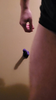 Trying Out the Dildo on the Wall