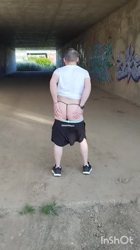 In Showing Her Ass in a Thong