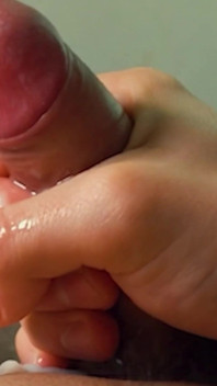 A Young Guy Jerks off in the First Person and Cums Loudly on Camera.