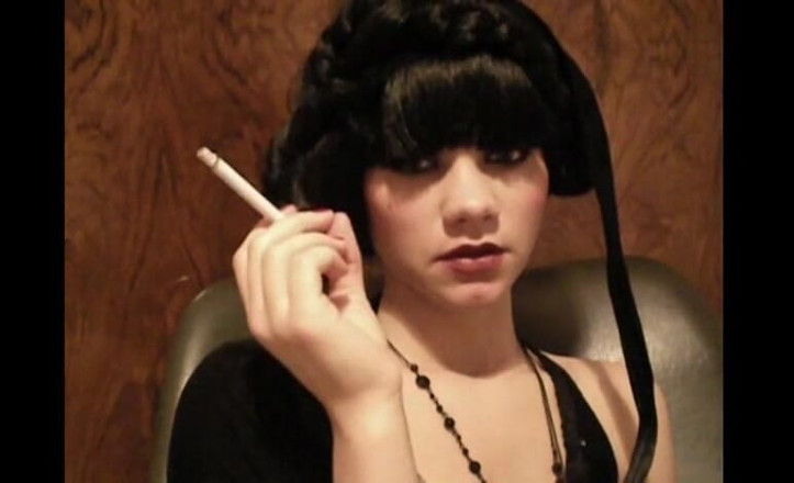 Femdom Austria: Glamorous beauty smoking a cigarette