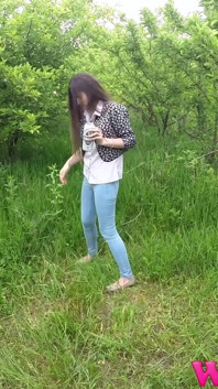 Skinny Brunette with Full Bladder Has to Pee in the Forest and Wet the Tall Grass Touching Her Wet Pussy