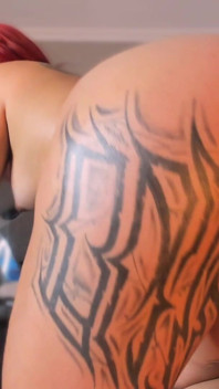 Latina Shakes Her Tattooed Butt