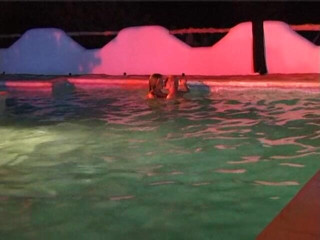 Naughty Girls: Two sexy lesbian chicks are swimming together in the swimming...