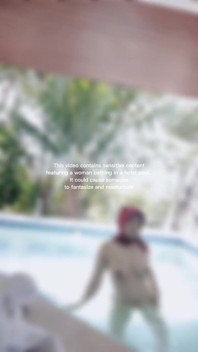 Woman Hijab Bathing Naked in an Open-air Hotel Pool