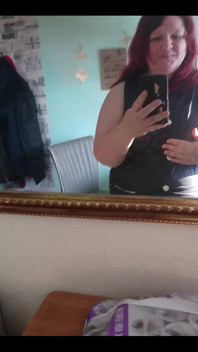 Showing off in a cool lab coat in front of the mirror