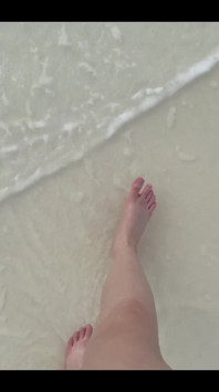 Running my bare feet on the white beach sand by the ocean.