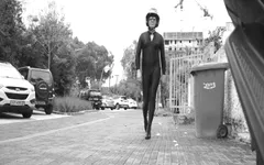 Impeccable Latex Suit and Heels.