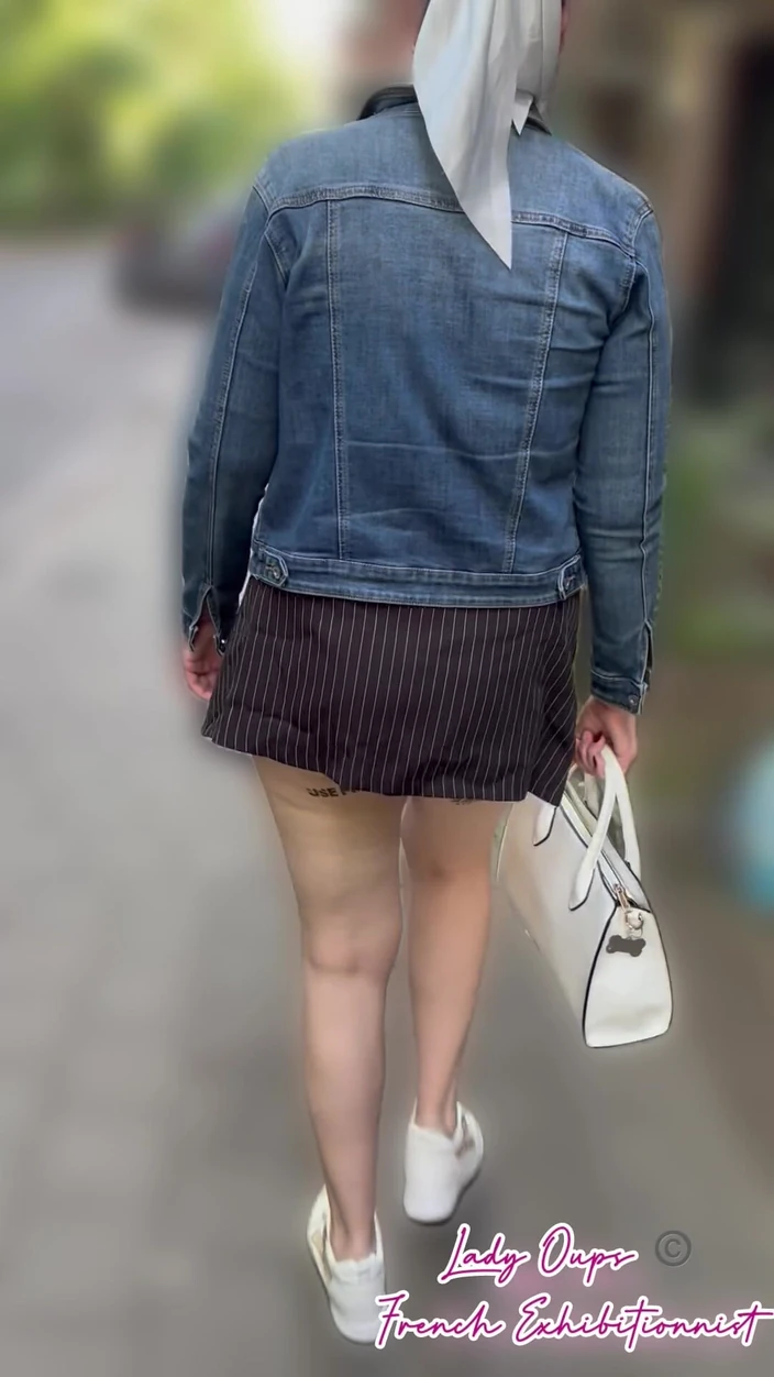 Exhibition in the City Center in a Micro Skirt with an Anal Plug in a Sexy Slut