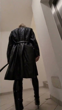 Public Walk in Parking House, Blonde in Overknee Boots, Red Pvc Dress and Long Leather Coat.