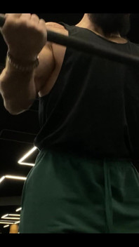 Doing a Biceps Curls with a Straight Barbell