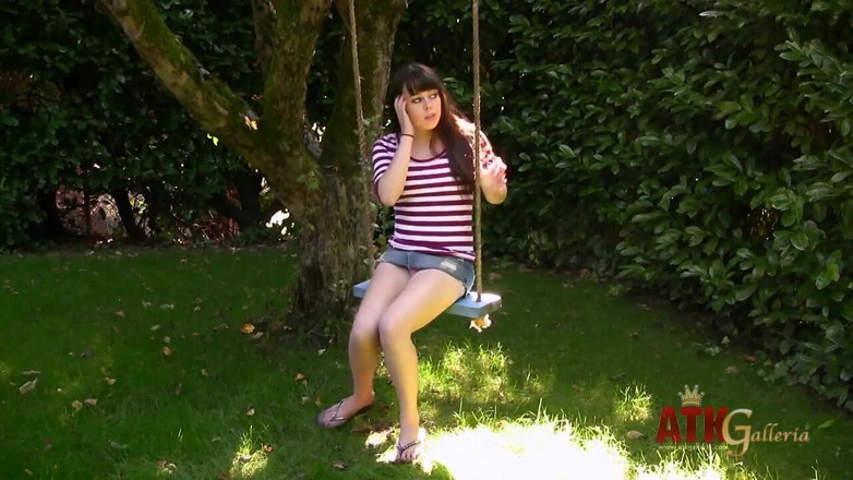 ATK Fans (Solo): Dark haired teen Erin Taylor fingers her pussy outdoors before...