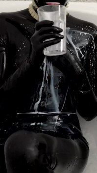 Rubber Slut Swallowing and Bathing in Milk