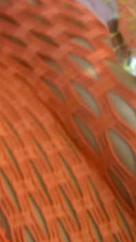 Glass Dildo Solo em um body de arrastão laranja - peituda morena brinca no sofá