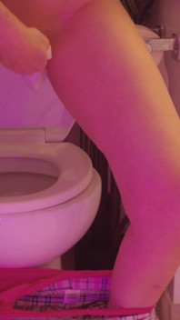 Emily pissing in the bathroom