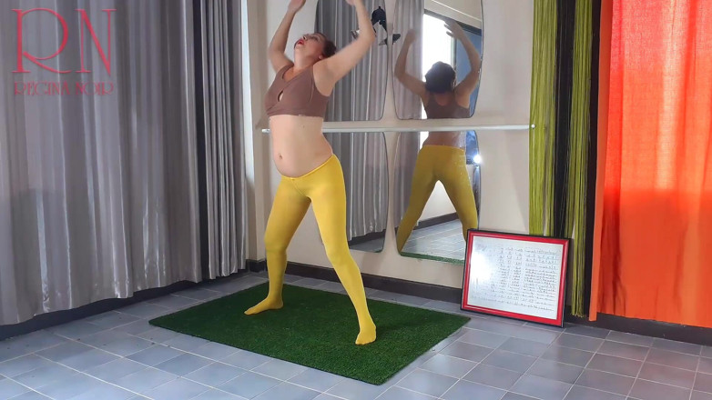 Regina Noir: Regina Noir. Yoga in yellow tights doing yoga in the...