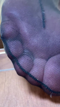 Goddess with Long Legs and Big Ass in Black Pantyhose on the Table Plays with a Toe Ring Above Your Face